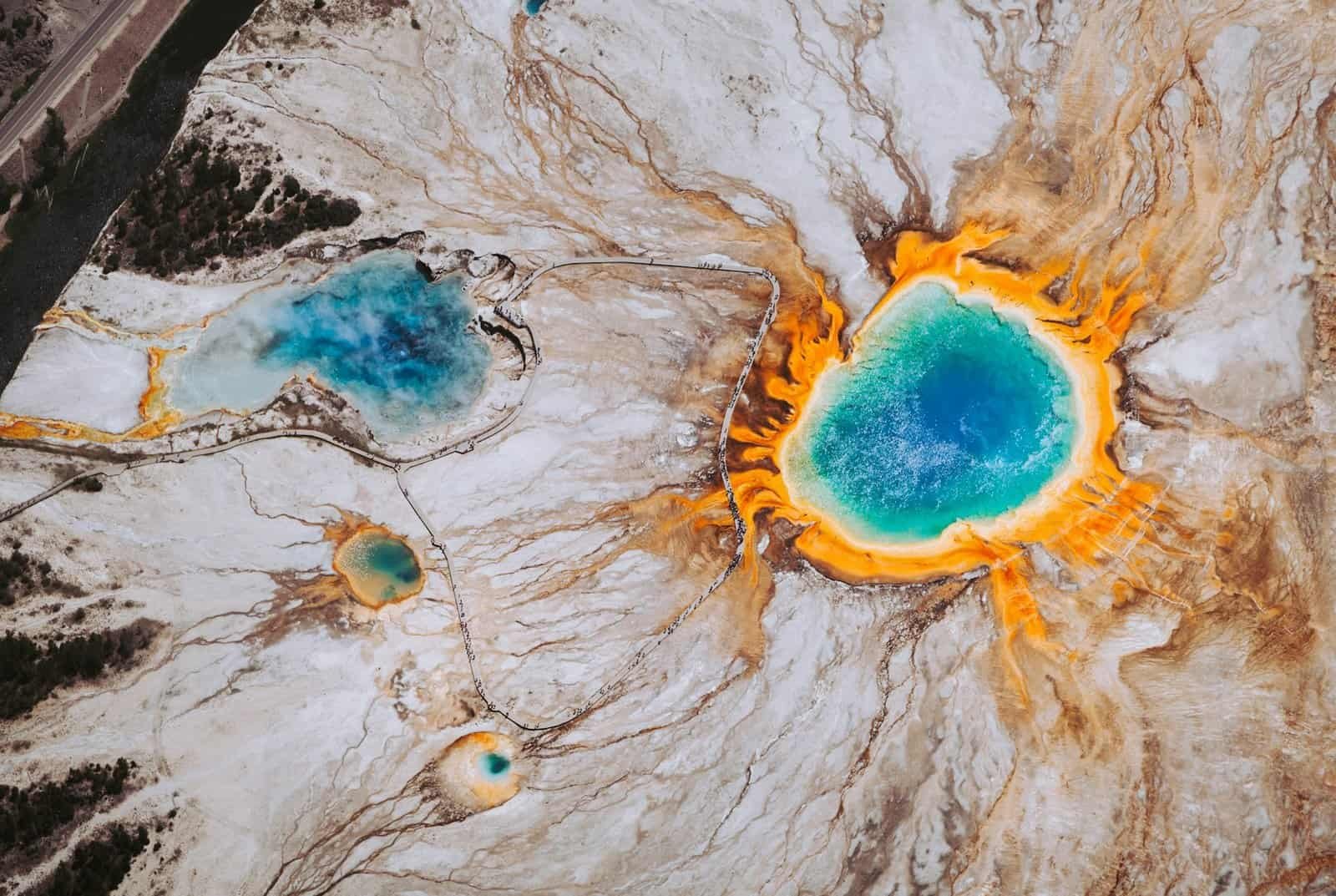 Yellowstone National Park geothermal hot springs with vibrant blue and orange hues.